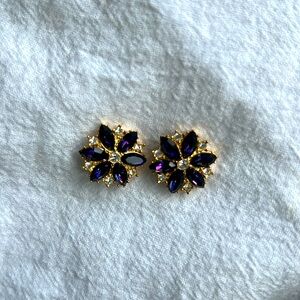 Purple and “diamond” rhinestone costume earrings. Post backing.